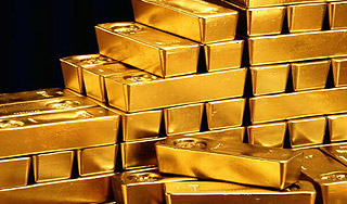 Цены на золото пошли вниз из-за доллара