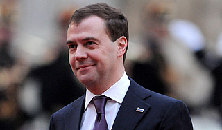 Медведев поздравил с отменой "конца света"